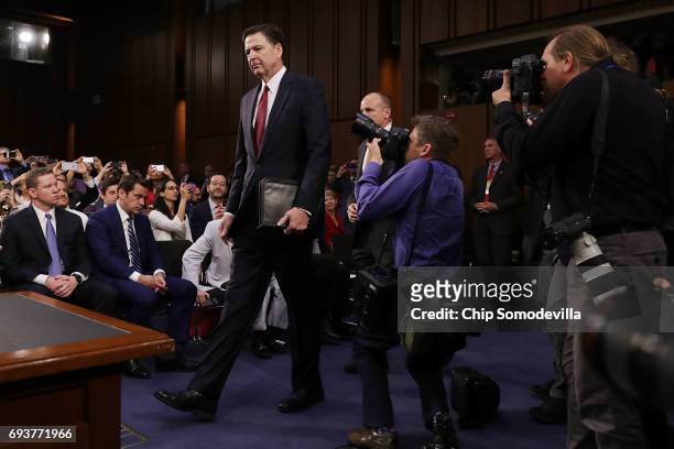 Former FBI Director James Comey arrives before testifying to the Senate Intelligence Committee in the Hart Senate Office Building on Capitol Hill...