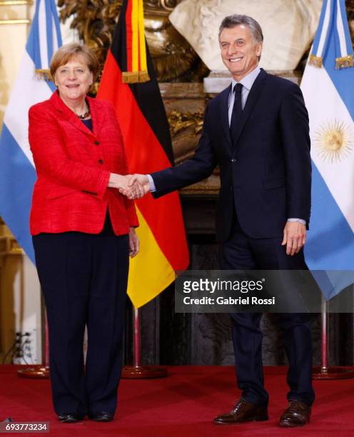 German Chancellor Angela Merkel and President of Argentina Mauricio Macri shake hands prior a press conference as part of an official visit of German...