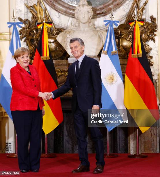 German Chancellor Angela Merkel and President of Argentina Mauricio Macri shake hands prior a press conference as part of an official visit of German...