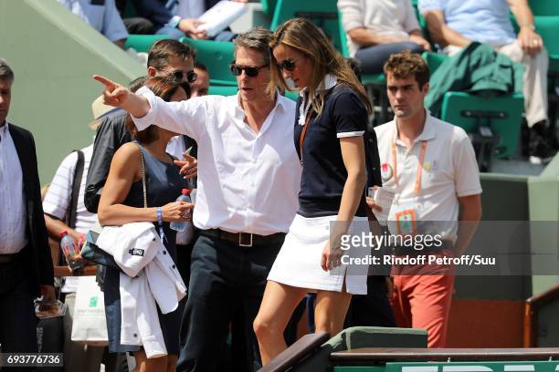Actor Hugh Grant and his partner Anna Eberstein are spotted at Roland Garros on June 8, 2017 in Paris, France.