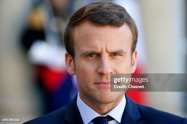 French President Emmanuel Macron makes a statement next to Peruvian President Pedro Pablo Kuczynski during a press conference after their meeting at...