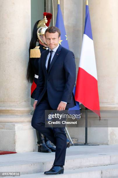 French President Emmanuel Macron walks back inside the Elysee Presidential Palace after his meetig with Peruvian President Pedro Pablo Kuczynski on...