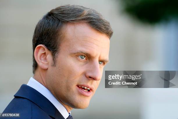 French President Emmanuel Macron makes a statement next to Peruvian President Pedro Pablo Kuczynski during a press conference after their meeting at...