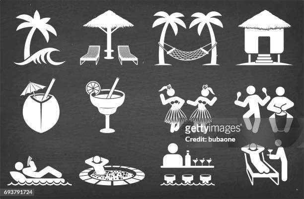 tropical vacation vector icon set on black chalkboard vector icon set - beach hut stock illustrations