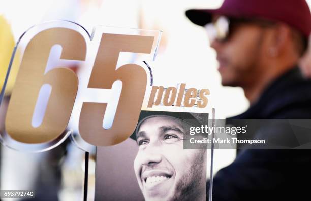 Plaque recognising the achievement of Lewis Hamilton of Great Britain and Mercedes GP reaching 65 career pole positions during previews for the...