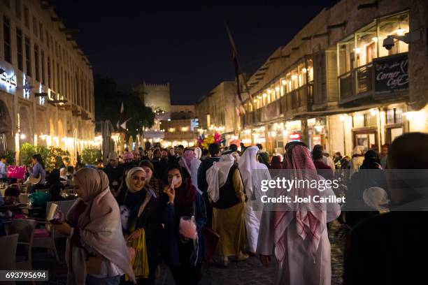 people in souk waqif in doha, qatar - qatar food stock pictures, royalty-free photos & images