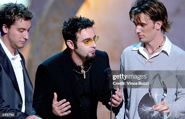 Lance Bass, Chris Kirkpatrick and J.C. Chasez of ''NSYNC accept their award for Favorite Musical Group or Band during the 28th Annual Peoples Choice...