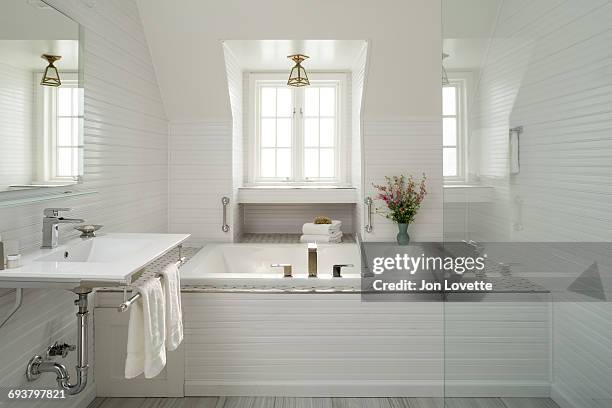 luxury white bathroom with bathtub - hotel bathroom stock pictures, royalty-free photos & images