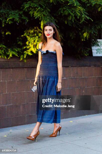 Calu Rivero wears a denim Anija Stella McCartney dress outside the Stella McCartney Spring 18 presentation on June 8, 2017 in New York City.