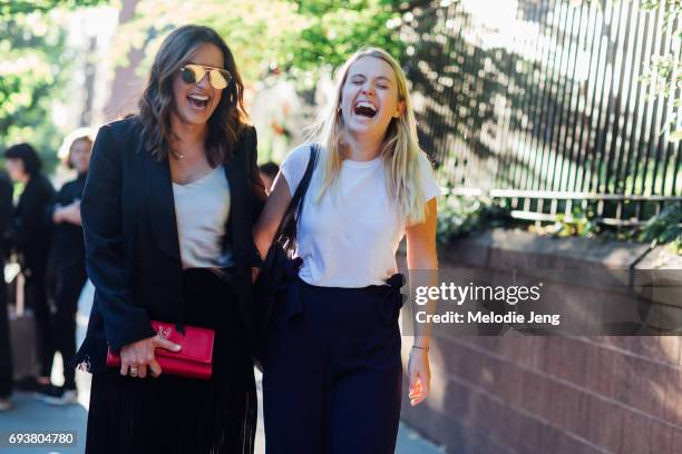 Mariska Hargitay wears a black and white outfit and carries a red YSL clutch outside the Stella McCartney Spring 18 presentation on June 8, 2017 in...