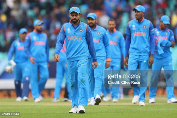 Virat Kohli of India leads the team off the field after being defeated by Sri Lanka in the ICC Champions trophy cricket match between India and Sri...