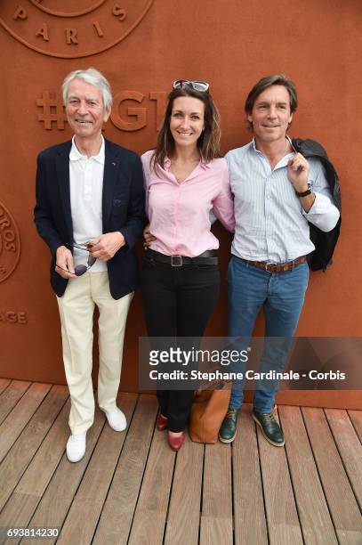 Journalists Jean-Claude Narcy, Anne-Claire Coudray and her companion Nicolas Vix attend the French Tennis Open 2017 - Day Twelve at Roland Garros on...
