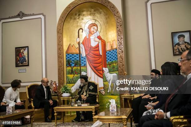 Egyptian Coptic Pope Tawadros II meets French Foreign Minister Jean-Yves Le Drian at the headquarters of St. Mark's Coptic Orthodox Cathedral in...