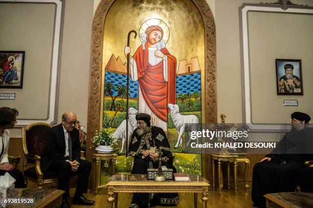 Egyptian Coptic Pope Tawadros II meets French Foreign Minister Jean-Yves Le Drian at the headquarters of St. Mark's Coptic Orthodox Cathedral in...