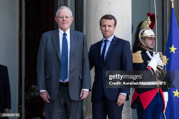 French President Emmanuel Macron welcomes President of the Republic of Peru Pedro Pablo Kuczynski for a meeting at the Elysee Palace on June 8, 2017...