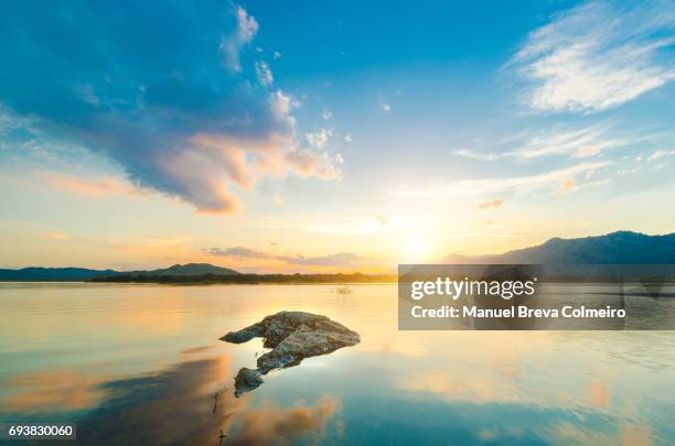 sunset at the lake - bright sun stock pictures, royalty-free photos & images