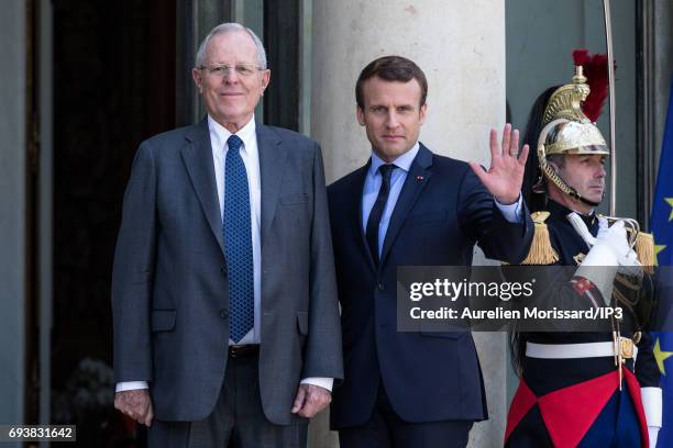 French President Emmanuel Macron welcomes President of the Republic of Peru Pedro Pablo Kuczynski for a meeting at the Elysee Palace on June 8, 2017...