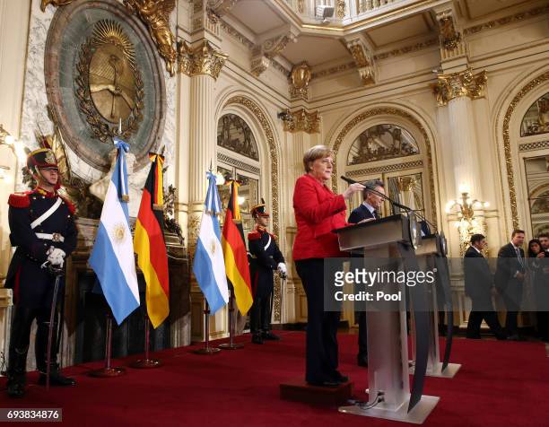 German Chancellor Angela Merkel speaks during a press conference as part of an official visit of German Chancellor Angela Merkel to Argentina at Casa...