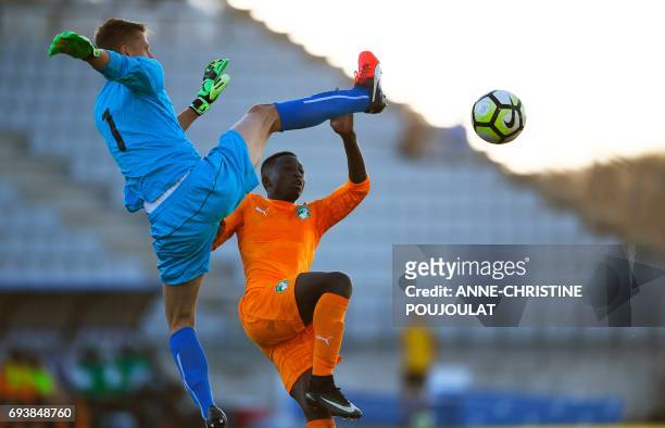 Czech Republic's goalkeeper Jan Plachy vies with Ivory Coast's Jean Thiery Lazare Amani during the Under 21 international football semi- final match...