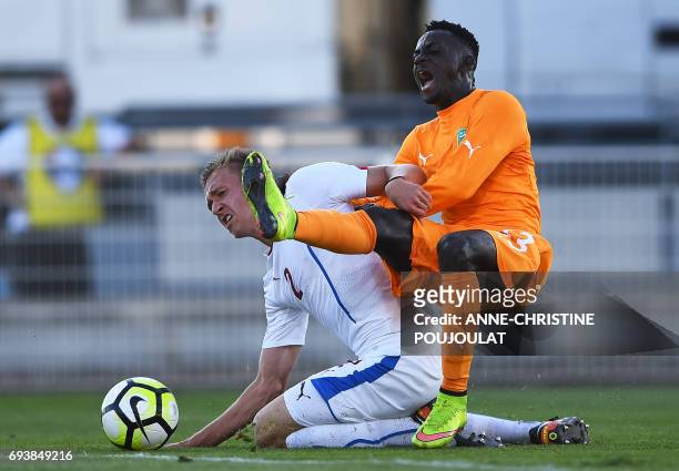 Czech's defender Pavel Tkac vies with Ivory Coast's forward Ake Arnaud Loba during the Under 21 international football semi- final match Ivory Coast...