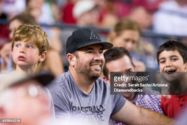 Zach Lind member of the band Jimmy Eat World watches a game against the Arizona Diamondbacks and San Diego Padres at Chase Field on June 6, 2017 in...