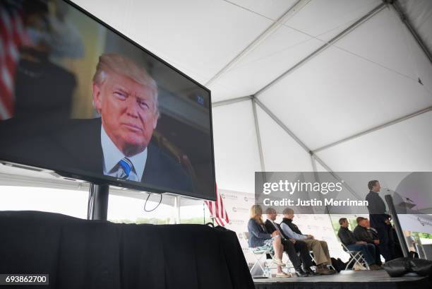 President Donald Trump delivers a recorded message at the grand opening of Corsa Coal's Acosta Deep Mine on June 8, 2017 in Friedens, Pennsylvania....