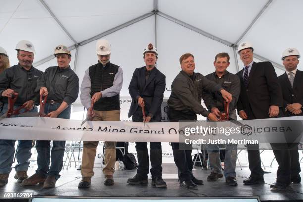 George Dethlefsen, CEO Corsa Coal Corp., center, is joined by fellow Corsa Coal employees and dignitaries as they cut the ribbon at the grand opening...