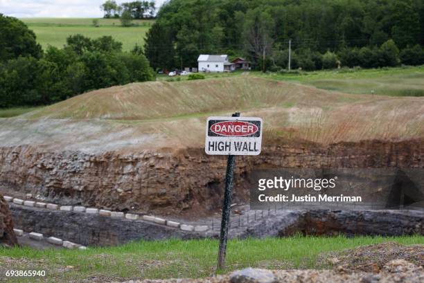 Danger sign is posted above the high wall of Corsa Coal's Acosta Deep Mine on June 8, 2017 in Friedens, Pennsylvania. The new coal mine, which...