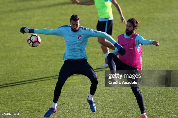 Olcay Sahan and Harun Tekin of Turkish National Football Team attend a training session before of FIFA 2018 World Cup Qualifiers match between Turkey...