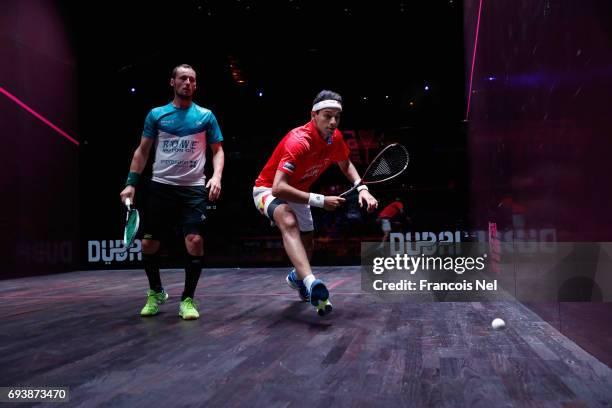 Mohamed El Shorbagy of Egypt competes against Gregory Gaultier of France during day three of the PSA Dubai World Series Finals 2017 at Dubai Opera on...