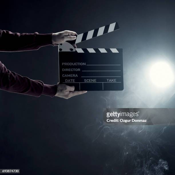 hands holding film slate - film director stock pictures, royalty-free photos & images