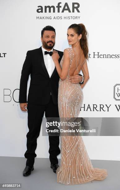 Designer Zuhair Murad and model Izabel Goulart arrive at the amfAR Gala Cannes 2017 at Hotel du Cap-Eden-Roc on May 25, 2017 in Cap d'Antibes, France.