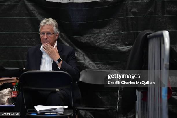 Former Northern Ireland First Minister and DUP leader Peter Robinson crunches numbers for his party as counting gets underway at the Titanic...