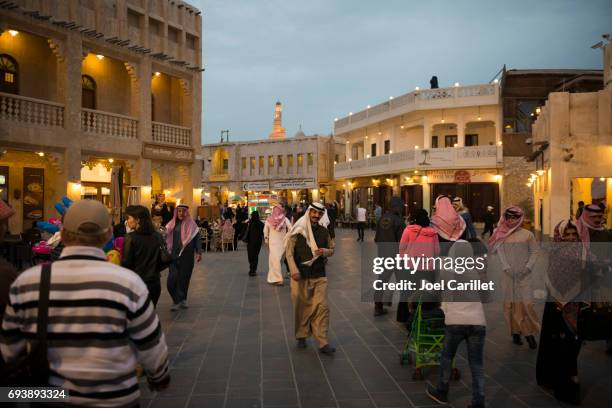 people in souk waqif in doha, qatar - qatar night stock pictures, royalty-free photos & images