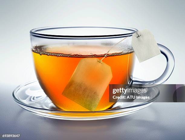 tea cup bag - teebeutel stock-fotos und bilder