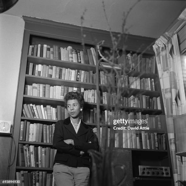 April 1959: Writer and playwright Lorraine Hansberry poses for a portrait in her apartment at 337 Bleecker Street in April, 1959 in New York City,...