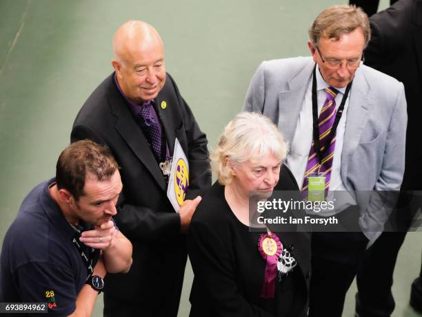 Party members and officials watch a television feed of election results at the Silksworth Community Pool, Tennis and Wellness Centre as the general...