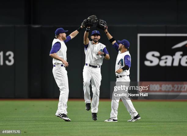 Jeremy Hazelbaker, Rey Fuentes and Gregor Blanco of the Arizona Diamondbacks celebrate a 15-3 win against the San Diego Padres at Chase Field on June...