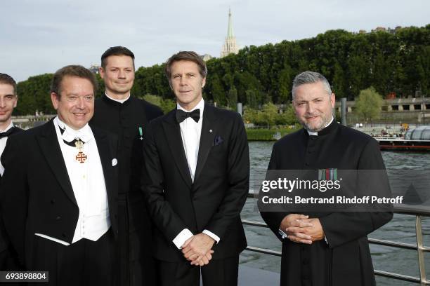 Lawyer Jean-Louis Bosteels, Abbee Gregoire Prichodko, Prince Emmanuel Philibert de Savoy and Abbee Franck Certin attend Charity Gala to Benefit the...