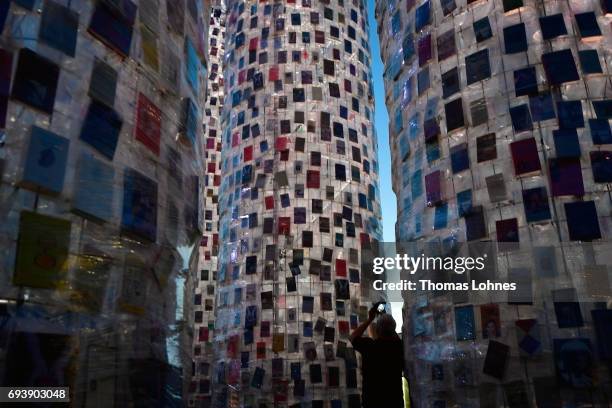 The artwork 'The Parthenon of Books' with donated books by the artist Marta Minujin is illuminated at night on June 8, 2017 in Kassel, Germany. The...