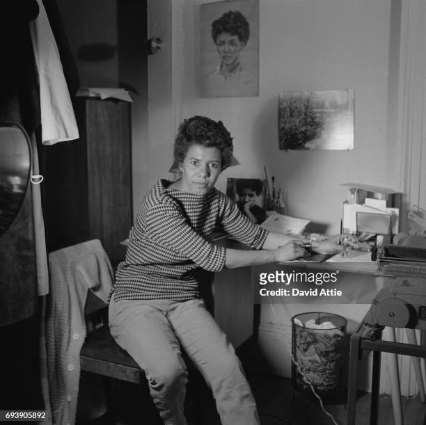 April 1959: Writer and playwright Lorraine Hansberry poses for a portrait in her apartment at 337 Bleecker Street in April, 1959 in New York City,...