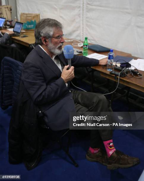 Sinn Fein Leader Gerry Adams wears socks stating &quot;beware of the beast&quot; at the Titanic exhibition centre in Belfast where counting is taking...