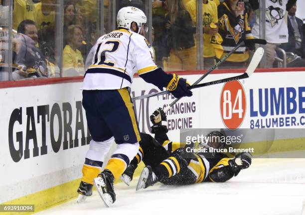 Mike Fisher of the Nashville Predators collides with Sidney Crosby of the Pittsburgh Penguins in the first period in Game Five of the 2017 NHL...