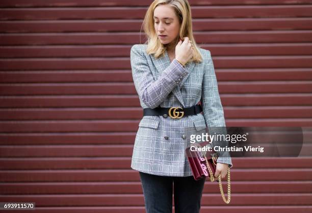 Sonia Lyson wearing a grey checked blazer jacket Zara, a black Gucci belt, flared cropped denim jeans Mother Denim, shoes Aeyde, bag Pinco on June 8,...