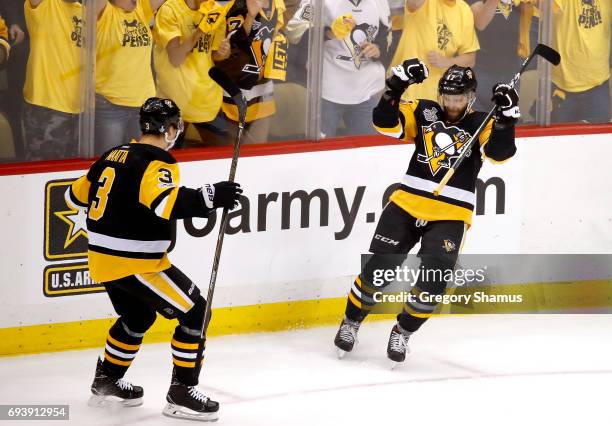 Bryan Rust of the Pittsburgh Penguins celebrates with Olli Maatta after scoring his team's second goal in the first period against the Nashville...