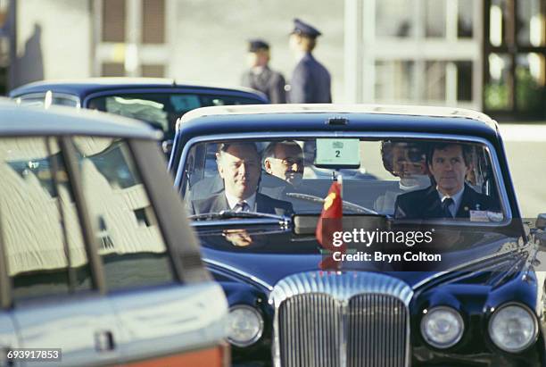 Soviet leader Mikhail Gorbachev sits and talks with Margaret Thatcher, UK Prime Minister, as they travel by car upon his arrival at RAF Brize Norton,...