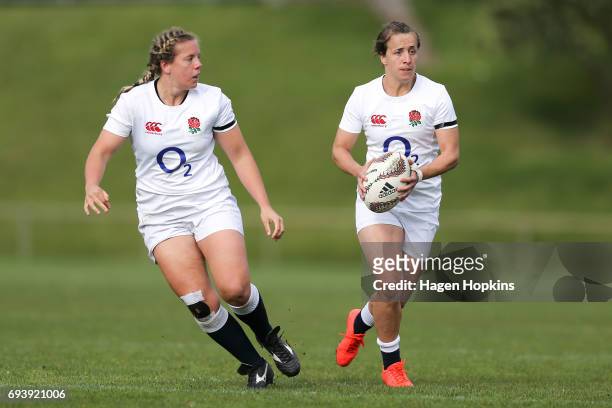 Katy Mclean of England makes a break with Vickii Cornborough in support during the Women's International Test match between the Australian Wallaroos...