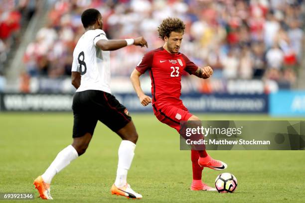 Fabian Johnson of the U.S. National Team attepts to elude Khaleem Hyland of Trinidad & Tabago during the FIFA 2018 World Cup Qualifier at Dick's...