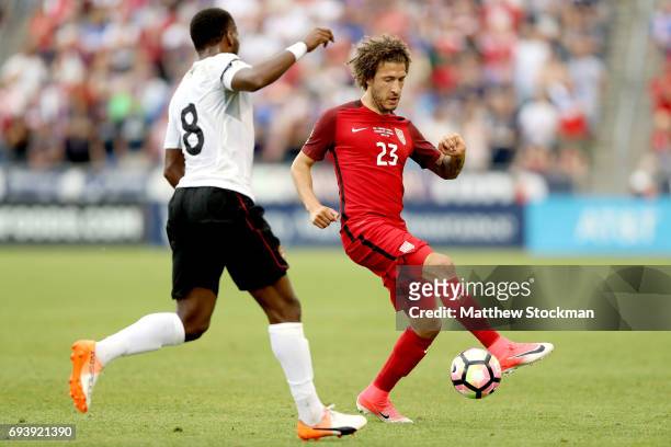 Fabian Johnson of the U.S. National Team attepts to elude Khaleem Hyland of Trinidad & Tabago during the FIFA 2018 World Cup Qualifier at Dick's...