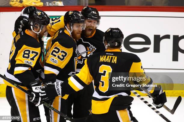 Phil Kessel of the Pittsburgh Penguins celebrates with teammates after scoring his team's fifth goal against the Nashville Predators in the second...